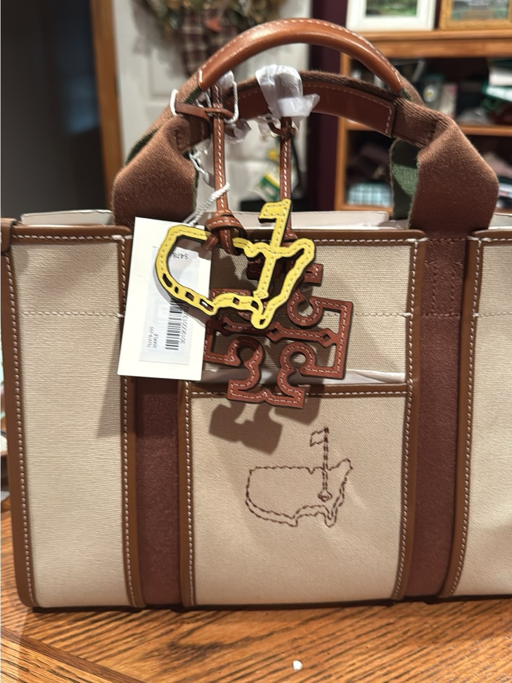 Tory Burch Beige Canvas Tote with Brown Trim and Yellow Charm Augusta National